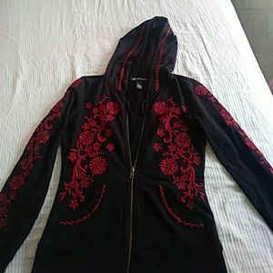a black hoodie with red